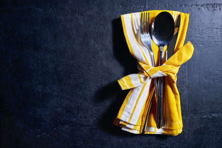 cutlery and napkin on stone table. Table setting.の写真素材