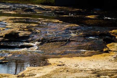 Flowing water over rocks in a creekの写真素材
