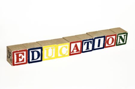 wooden blocks lined up horizontally to spell out educationの写真素材