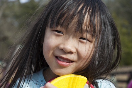Close up of a young pretty Asian girlの写真素材