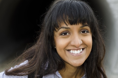 pretty young Middle Eastern student happy and smilingの写真素材