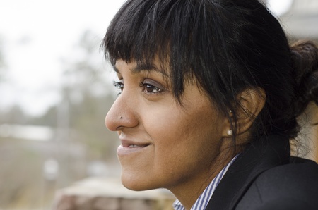 profile of a middle eastern business woman looking into th edistanceの写真素材