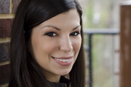 beautiful woman looking into the camera and smiling の写真素材