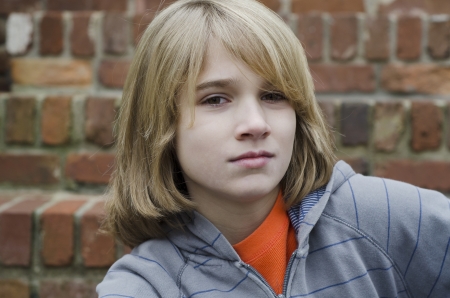 Tough young kid staring at the shooterの写真素材