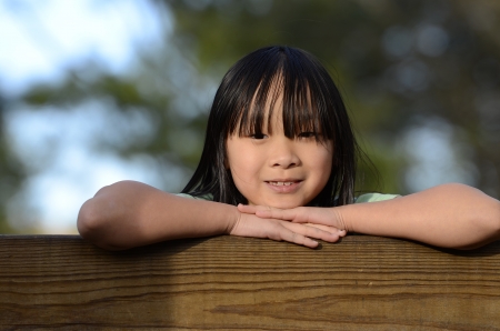 Cute young Asian girl posing for the cameraの写真素材