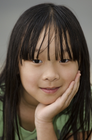 young cute Asian girl thinking things overの写真素材