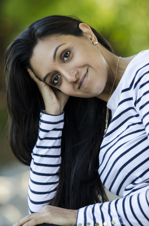 Very pretty Indian woman poses nicely for the cameraの写真素材