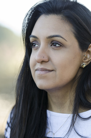 Beautiful young Indian girl thinking things overの写真素材