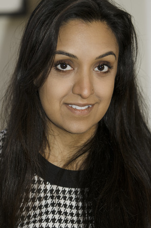 Beautiful young Indian woman looking at meの写真素材