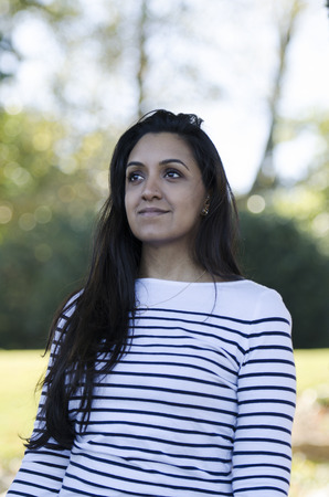 Gorgeous young Indian woman looking intot he distanceの写真素材