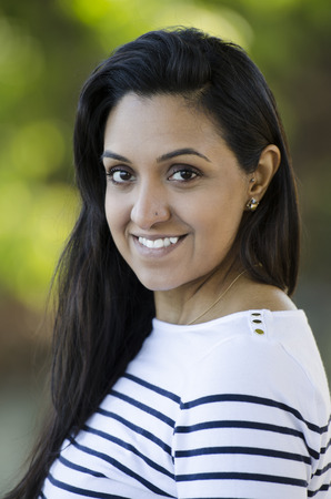 Gorgeous Indian woman looking into the camera with beautiful eyesの写真素材