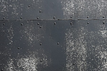 Black Riveted Sheet Metal Backgroundの写真素材