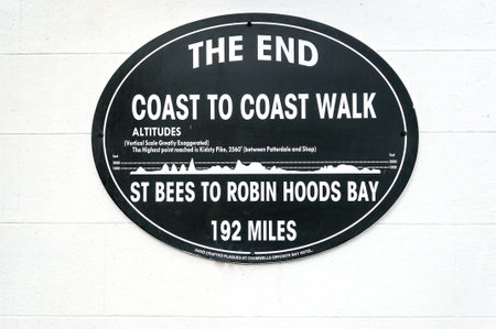 Robin Hoods Bay,England - July 11, 2016: Plaque marking the end point of the 192 mile coast to coast walk, beginning in St Bees Head Cumbria on England's west coast and ending on the east coast at Robin Hoods Bay North Yorkshireのeditorial素材