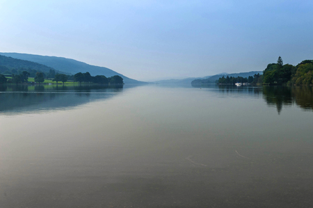 Misty Coniston Water, flat, calm, early autumn, soft coloursの写真素材