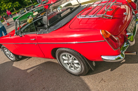Red MGB Roadster, Hull, East Yorkshire, England, 11th June 2017, Classic British MG Sports Car, side view of red MGB Roadster sports car, at East Park Classic Car Run.のeditorial素材