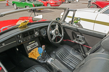 Red MGB Roadster, Hull, East Yorkshire, England, 11th June 2017, Classic British MG Sports Car, close up showing interior and dashboard of red MGB Roadster, at East Park Classic Car Run.のeditorial素材