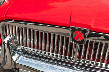 Hull, East Yorkshire, England, 11th June 2017, Classic British MG Sports Car, close up showing grill and badge of red MGB sports car, at East Park Classic Car Run.のeditorial素材