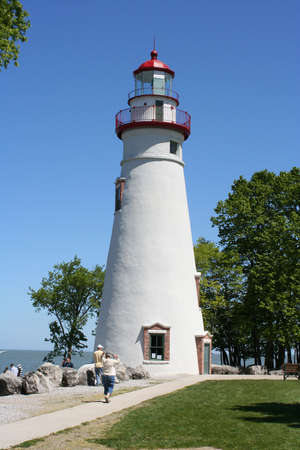 Lighthouse with a bright blue skyの写真素材