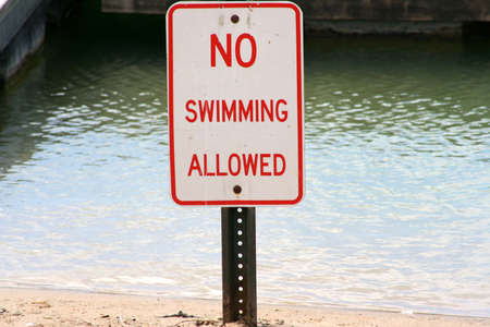 Swimming Sign by waterの写真素材