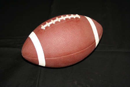 Football isolated on black background