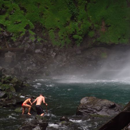 Costa Rica,People walking near waterfallの写真素材
