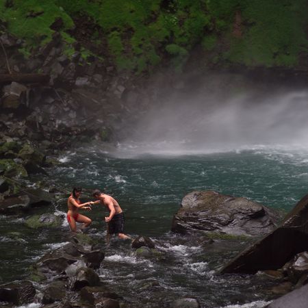 Costa Rica,People walking near waterfallの写真素材