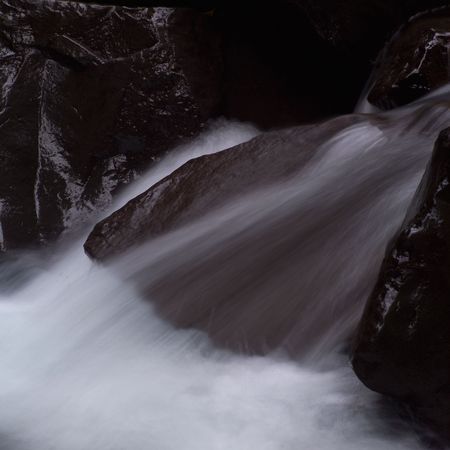 Costa Rica,Water flowing over rocksの写真素材