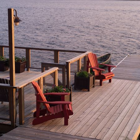 Lake of the Woods Ontario Canada,Dock with empty chairsの写真素材