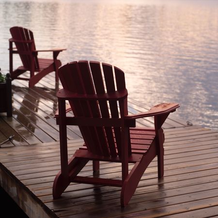 Lake of the Woods Ontario Canada,Empty chairs on dockの写真素材