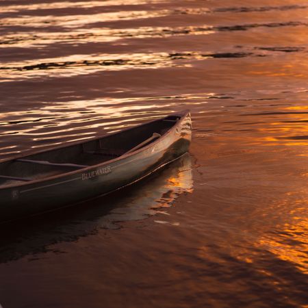 Lake of the Woods Ontario Canada,Empty canoe on the lakeの写真素材