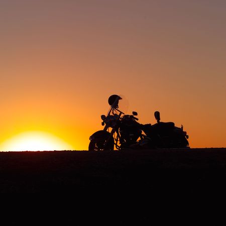Canadian Prairies,Silhouette of motorcycleの写真素材