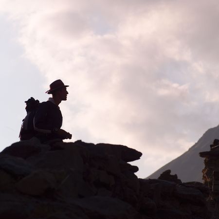 Ollantaytambo Ruins in Peru, Silhouette of a tourist in Peruの写真素材
