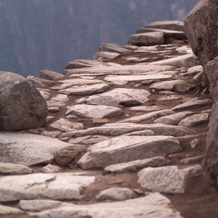 Peru - Machu Picchu, Stone pathway on hillside in Machu Picchuの写真素材