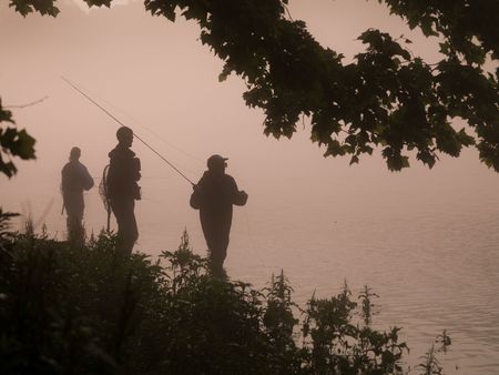 Branson Missouri, Silhouette of men fishingの写真素材