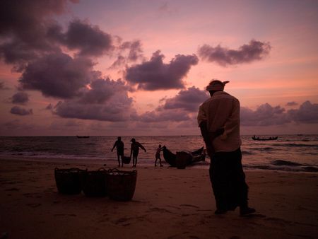 Fishing boat on the beach of the Arabian Sea, Kerala, India