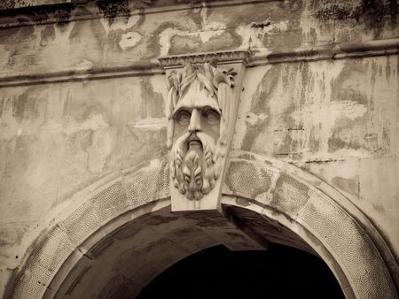 Engraved face on building in Mumbai India