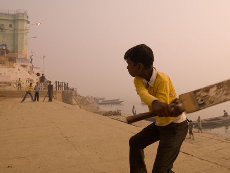 Young boy in India holding a cricket batの写真素材
