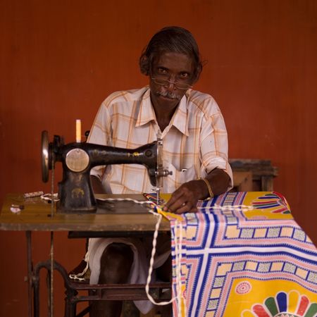 Man sewing in India