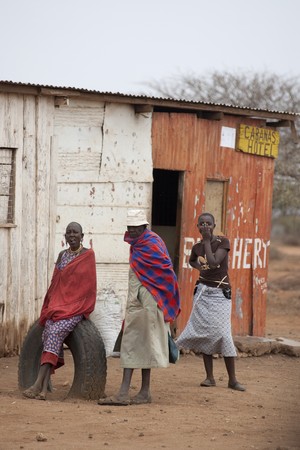 Villagers by hut in Kenyaのeditorial素材