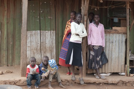 Villagers by hut in Kenyaのeditorial素材