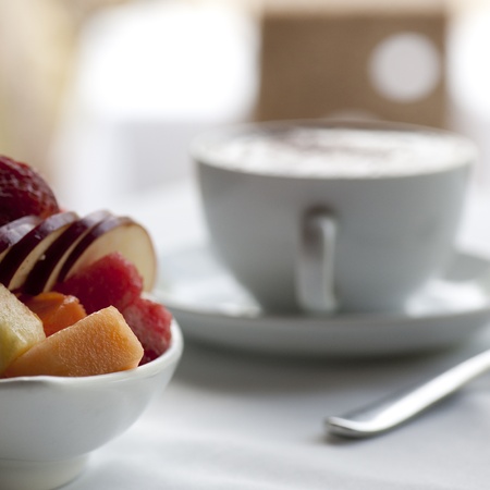 Fresh fruit and cappuccino cup on a table setting in Costa Ricaの写真素材