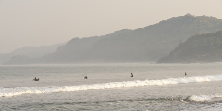 Tourists surfing in the sea, Sayulita, Nayarit, Mexicoの写真素材
