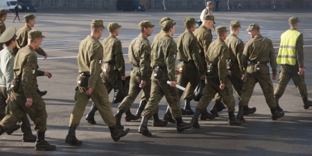 Russian soldiers marching at Winter Palace, State Hermitage Museum, Palace Square, St. Petersburg,...