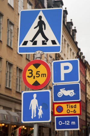 Low angle view of road signs, Stora Nygatan, Gamla Stan, Stockholm, Swedenの写真素材