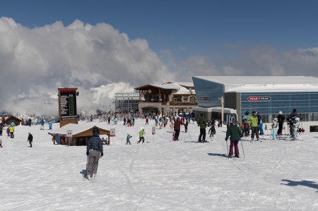 Tourists skiing near Peak 2 Peak Gondola terminal, Whistler, British Columbia, Canadaのeditorial素材