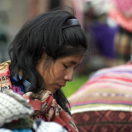 Profile of a Quechua woman thinking, Plaza Regocijo, Cuzco, Peruのeditorial素材