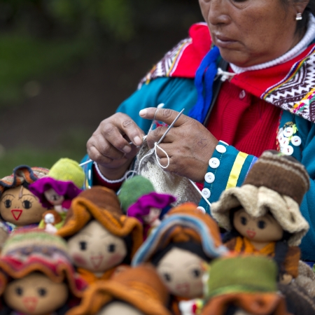 Woman selling dolls at a market, Plaza Regocijo, Cuzco, Peruのeditorial素材