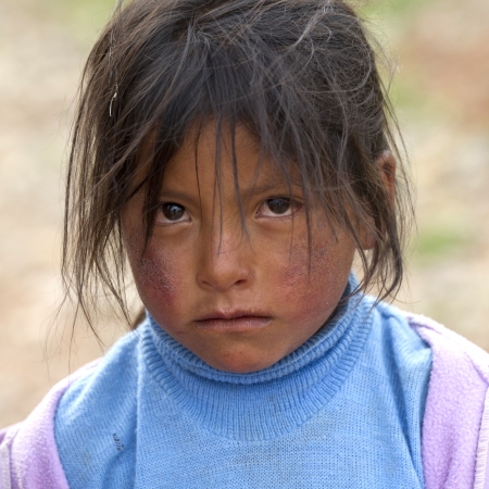 Portrait of a girl with tousled hair, Sacred Valley, Cusco Region, Peruのeditorial素材
