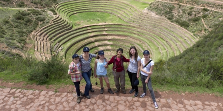High angle view of people with Incan agricultural terraces in the background, Moray, Machu Picchu, Cusco Region, Peruのeditorial素材