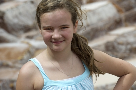 Portrait of a teenage girl at a salt mine, Maras, Salinas, Sacred Valley, Cusco Region, Peruのeditorial素材